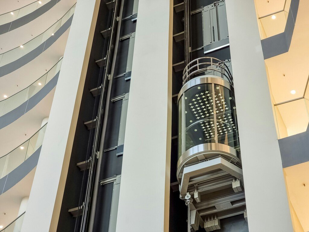 glass capsule elevator ,lift at luxury hotel or building.modern glass elevator to the upper floors